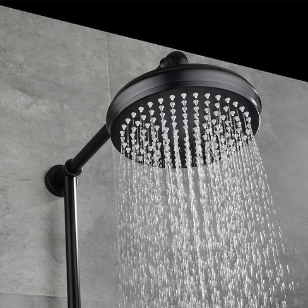 Modern bathroom with matte black rainfall shower head and glass enclosure
